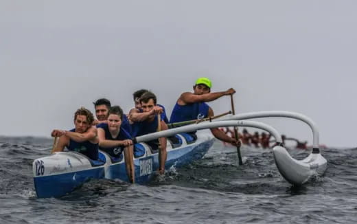 a group of people in a boat