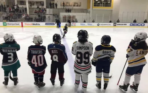 a group of people wearing hockey uniforms