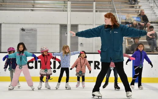 a person and kids ice skating