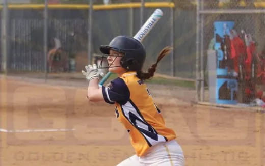 a baseball player swinging a bat