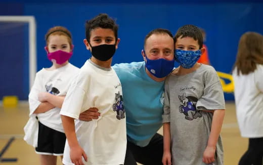 a group of kids wearing face masks