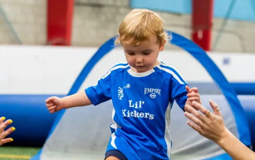 a boy in a blue shirt