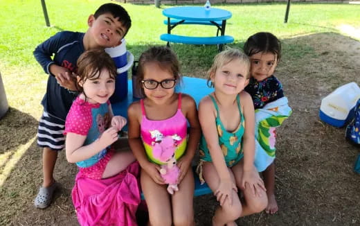 a group of children posing for a photo