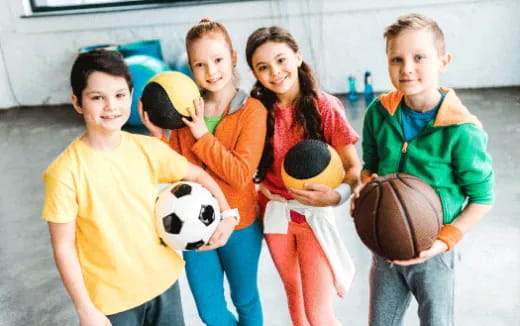 a group of kids wearing clothing