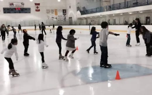 a group of people on an ice rink