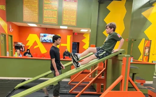 a person jumping over a bar