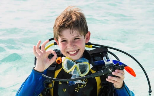 a boy wearing scuba gear