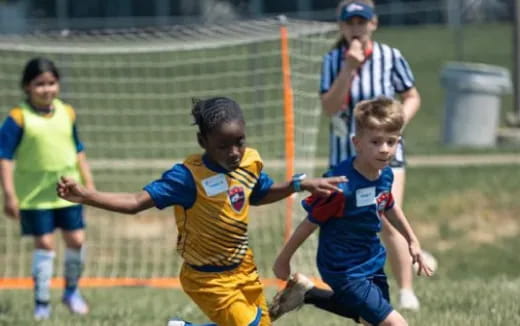 a group of people playing football