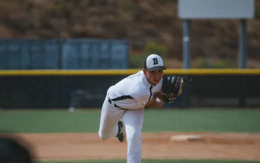 a baseball player throwing a ball