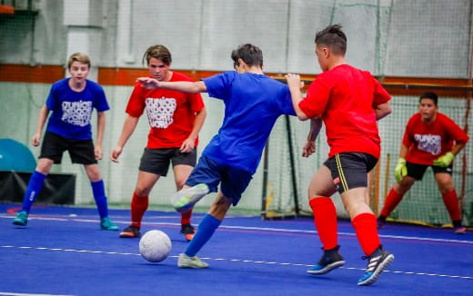 a group of boys playing football