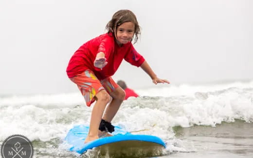 a girl riding a surfboard