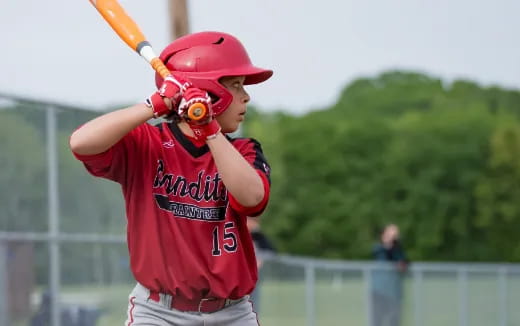 a young boy playing baseball