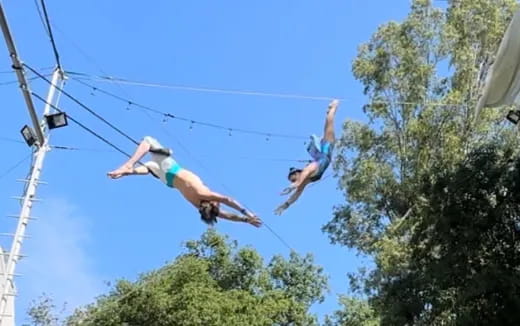 a group of people jumping in the air