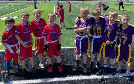 a group of boys in football uniforms