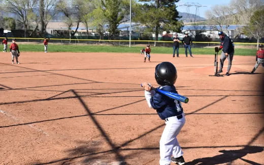 a kid holding a baseball bat