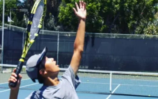 a couple of men playing tennis