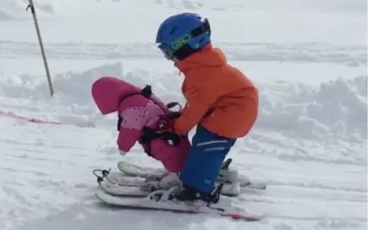 a kid on a snowboard