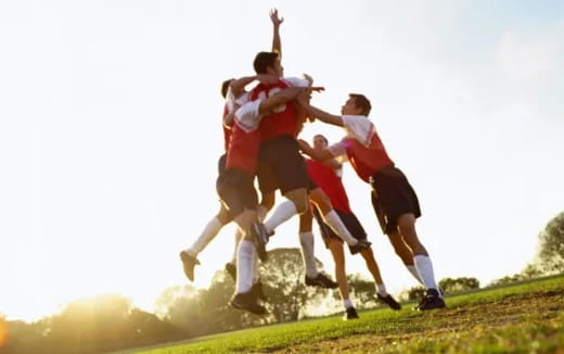 a group of men jumping in the air