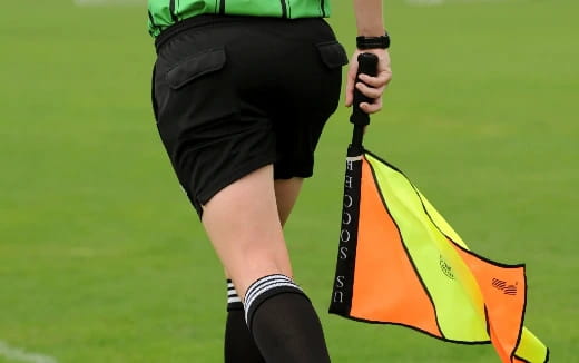 a person holding a yellow and black object