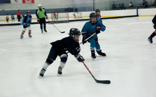 a group of people playing hockey