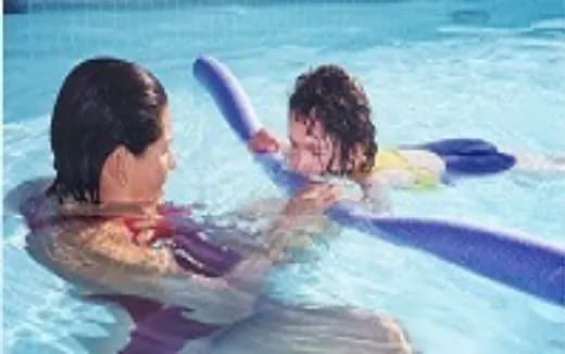 a couple of people in a pool