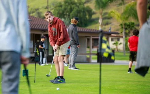 a group of people playing golf