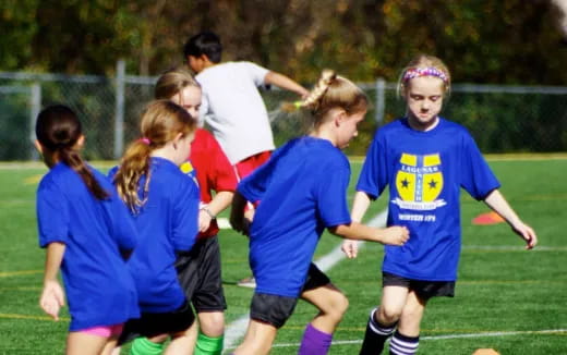 a group of girls playing football