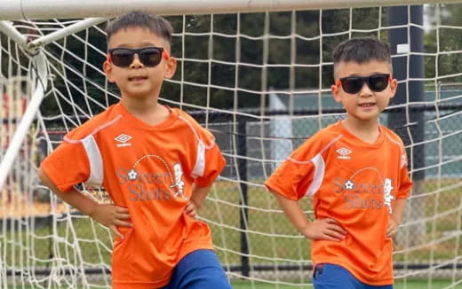 a couple of boys wearing sunglasses