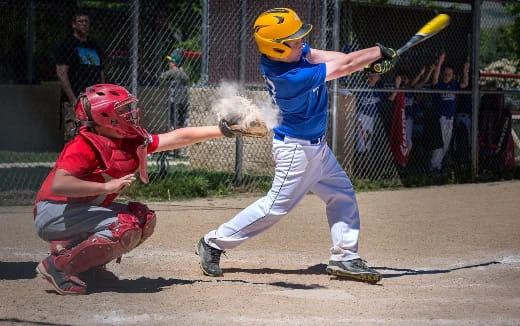 a baseball player swinging a bat