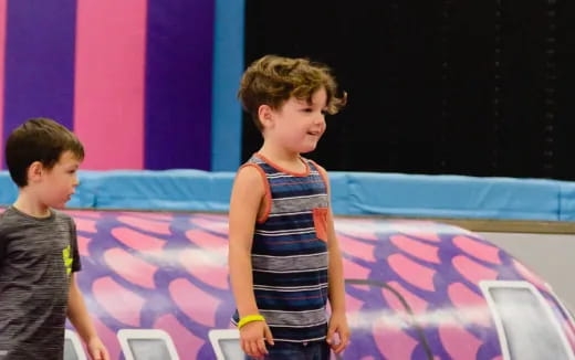 a boy standing on a stage