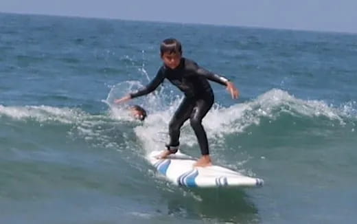 a man riding a surfboard