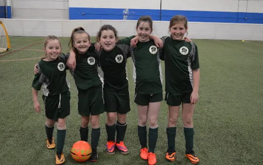 a group of girls in football uniforms