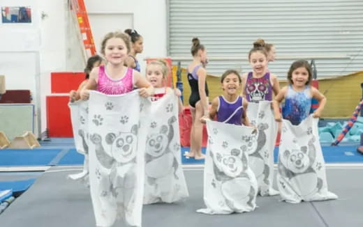 a group of girls in dresses