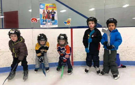 a group of kids wearing hockey gear