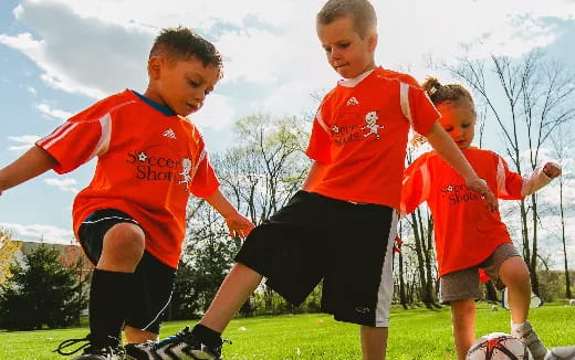 a group of boys playing football