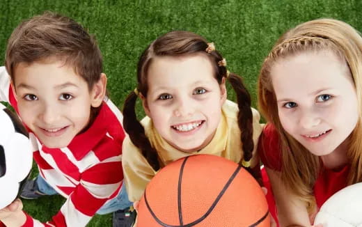 a group of children wearing basketball uniforms