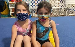 two girls wearing face paint