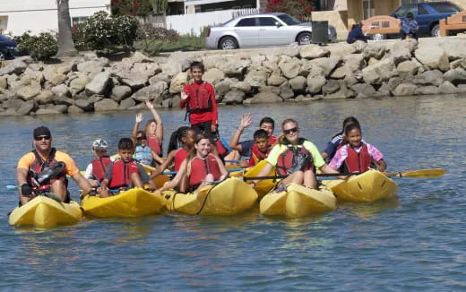 a group of people in kayaks