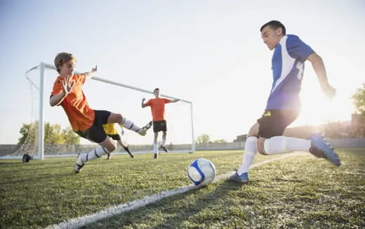 a group of people playing football