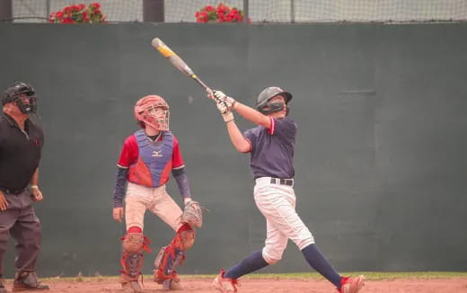 a baseball player swinging a bat