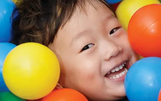 a close-up of a boy smiling