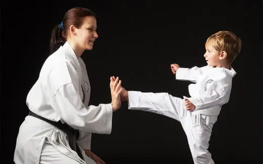 a man and a child in karate uniforms