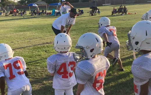 a group of kids wearing helmets