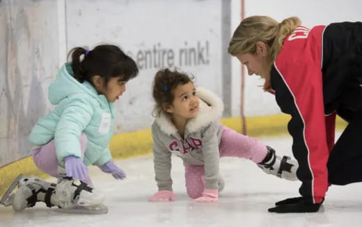 a person and a girl on ice