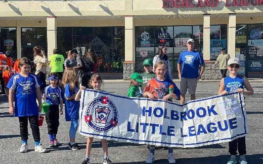 a group of children holding a banner