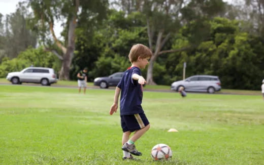a kid playing football
