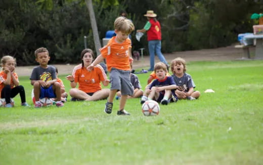 kids playing with a football ball