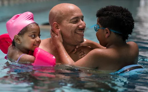 a person and a child in a pool