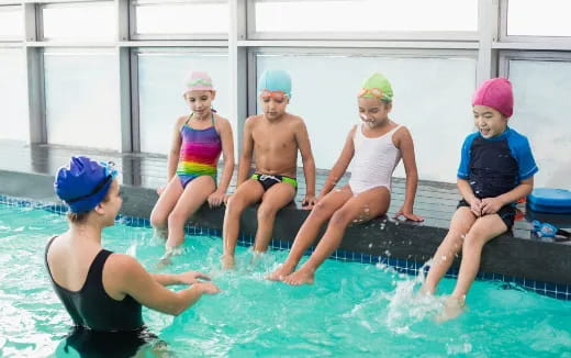 a group of kids in a pool