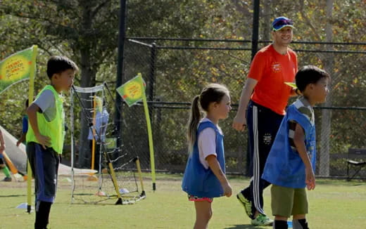 a group of kids playing football